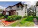 Two-story home featuring brick accents and lush landscaping creating a welcoming curb appeal in the community at 612 Fairmont Ave # D, Safety Harbor, FL 34695