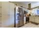 Kitchen featuring stainless steel refrigerator, oven, microwave, and plenty of cabinet space at 612 Fairmont Ave # D, Safety Harbor, FL 34695