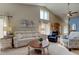 Comfortable living room with vaulted ceilings, a ceiling fan, and a variety of seating arrangements at 612 Fairmont Ave # D, Safety Harbor, FL 34695