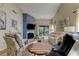 Bright living room boasts a fireplace, high ceilings, and comfortable seating, perfect for relaxing or entertaining at 612 Fairmont Ave # D, Safety Harbor, FL 34695