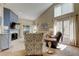 Bright living room featuring a fireplace, vaulted ceilings, and comfortable seating at 612 Fairmont Ave # D, Safety Harbor, FL 34695