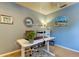 Office area with a powered sit stand desk, office supplies, decor and an accent rug at 612 Fairmont Ave # D, Safety Harbor, FL 34695