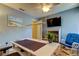 Bright office features a work desk, television and cheerful decor at 612 Fairmont Ave # D, Safety Harbor, FL 34695
