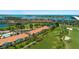 Beautiful aerial view of resort condos with golf course, tropical landscaping, and waterfront views at 6191 Bahia Del Mar Blvd # 204, St Petersburg, FL 33715