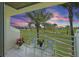 Enjoy the views from this charming balcony with tile floors and seating, overlooking the community golf course at 6191 Bahia Del Mar Blvd # 204, St Petersburg, FL 33715