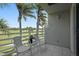 Enjoy scenic golf course views from your private balcony furnished with two chairs and a small table at 6191 Bahia Del Mar Blvd # 204, St Petersburg, FL 33715