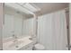 Traditional bathroom offers ample lighting, white tiling, and a spacious shower/tub combo at 6191 Bahia Del Mar Blvd # 204, St Petersburg, FL 33715