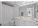 Well-lit bathroom featuring a double sink vanity and shower at 6191 Bahia Del Mar Blvd # 204, St Petersburg, FL 33715