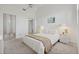 Relaxing bedroom with soft carpet, white decor, and a large mirrored closet at 6191 Bahia Del Mar Blvd # 204, St Petersburg, FL 33715