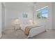 Serene bedroom with neutral tones, soft carpet, and bright lighting at 6191 Bahia Del Mar Blvd # 204, St Petersburg, FL 33715