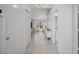 Bright hallway with tile flooring, closet, and view into the light and airy living area at 6191 Bahia Del Mar Blvd # 204, St Petersburg, FL 33715