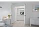 Bright hallway leading to an ensuite bathroom, offering privacy and convenience at 6191 Bahia Del Mar Blvd # 204, St Petersburg, FL 33715