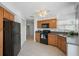 Well-lit kitchen area with appliances, tile floor, and pantry access at 6191 Bahia Del Mar Blvd # 204, St Petersburg, FL 33715
