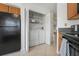 Convenient in-unit laundry closet with washer and dryer, and storage shelves at 6191 Bahia Del Mar Blvd # 204, St Petersburg, FL 33715
