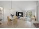 Bright open floor plan with built-in shelving and sliding glass doors to the balcony at 6191 Bahia Del Mar Blvd # 204, St Petersburg, FL 33715