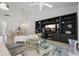 Open living room with stylish decor, media center, and access to the dining area at 6191 Bahia Del Mar Blvd # 204, St Petersburg, FL 33715