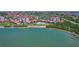 Waterfront community with a private beach, pool, and beautiful landscaping, as seen from an aerial perspective at 6361 Bahia Del Mar Blvd # 205, St Petersburg, FL 33715