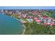 Aerial view of waterfront condo complex with pool, beach and boat dock at 6361 Bahia Del Mar Blvd # 205, St Petersburg, FL 33715