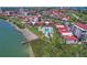 Aerial view showcases the waterfront community with a pool, dock, and stunning coastal setting at 6361 Bahia Del Mar Blvd # 205, St Petersburg, FL 33715