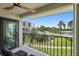 Balcony view showcasing lush landscaping, a community pool, and waterfront scenery for relaxation at 6361 Bahia Del Mar Blvd # 205, St Petersburg, FL 33715