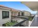 Condo exterior with covered walkway and balcony overlooking the water at 6361 Bahia Del Mar Blvd # 205, St Petersburg, FL 33715