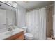 Bathroom featuring a large vanity, and a tub-shower with curtain at 6361 Bahia Del Mar Blvd # 205, St Petersburg, FL 33715