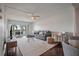 Bright living room with ceiling fan, hardwood floors and view to the balcony at 6361 Bahia Del Mar Blvd # 205, St Petersburg, FL 33715