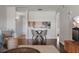 Charming living room with hardwood floors and kitchen view through wall opening at 6361 Bahia Del Mar Blvd # 205, St Petersburg, FL 33715
