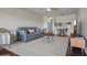 Bright living room with ceiling fan, hardwood floors, and view of kitchen at 6361 Bahia Del Mar Blvd # 205, St Petersburg, FL 33715