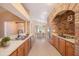 Spacious kitchen with brick accent and updated appliances overlooking the light-filled dining area at 6711 Thackston Dr, Riverview, FL 33578