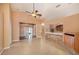 Open living room showcasing tile flooring, brick accents, and seamless flow to other living spaces at 6711 Thackston Dr, Riverview, FL 33578
