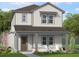 Charming two-story home featuring a covered porch and a combination of vertical and horizontal siding at 865 53Rd Ave N, St Petersburg, FL 33703