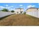 Large fenced backyard with ample space for outdoor activities and relaxation at 10101 Mangrove Well Rd, Ruskin, FL 33573