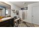Stylish bathroom featuring a sink, modern fixtures, a mirror, vanity and a walk-in shower at 10101 Mangrove Well Rd, Ruskin, FL 33573