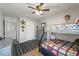A cozy bedroom with bunk beds, a dresser, a desk, and wood-look flooring at 10101 Mangrove Well Rd, Ruskin, FL 33573