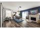 Dining room with wood floors, a fireplace, a chandelier and a table for six at 10101 Mangrove Well Rd, Ruskin, FL 33573