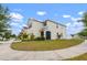Two-story home with a well-maintained lawn and sidewalks at 10101 Mangrove Well Rd, Ruskin, FL 33573