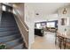 Foyer with staircase, tiled floors, and view into the living room at 10101 Mangrove Well Rd, Ruskin, FL 33573