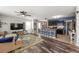 Open-concept living area with access to the kitchen, modern furnishings, and ample natural light at 10101 Mangrove Well Rd, Ruskin, FL 33573