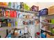 Well-organized pantry with multiple shelves to store groceries and household items at 10101 Mangrove Well Rd, Ruskin, FL 33573