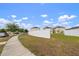 Residential street with sidewalks and newly constructed homes, showcasing community aesthetics at 10101 Mangrove Well Rd, Ruskin, FL 33573