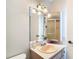 Bathroom showcasing a vanity with cabinets and a mirror at 10819 Los Santos Dr, Port Richey, FL 34668