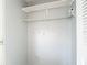 Empty closet with a white shelf and clothing rack at 10819 Los Santos Dr, Port Richey, FL 34668