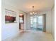 Adjacent to the kitchen, this dining area provides backyard access through sliding glass doors at 10819 Los Santos Dr, Port Richey, FL 34668