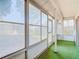 Enclosed sunroom with large windows providing natural light and views of the outdoors at 10819 Los Santos Dr, Port Richey, FL 34668