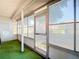 Bright sunroom with tile flooring and multiple windows at 10819 Los Santos Dr, Port Richey, FL 34668