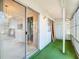 Enclosed porch featuring glass and sliding doors at 10819 Los Santos Dr, Port Richey, FL 34668