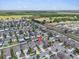 Wide aerial shot of the neighborhood with the subject property marked with a location pin at 14812 Boulder Pass Pl, Wimauma, FL 33598