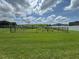 Community dog park, fully fenced in and featuring agility equipment and grassy area at 14812 Boulder Pass Pl, Wimauma, FL 33598