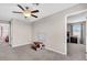 Open loft with ceiling fan and sight lines into adjacent room at 14812 Boulder Pass Pl, Wimauma, FL 33598